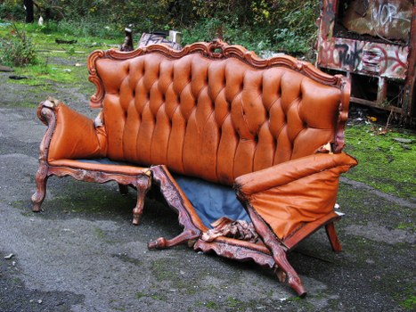 Crew member preparing commercial waste collection vehicle